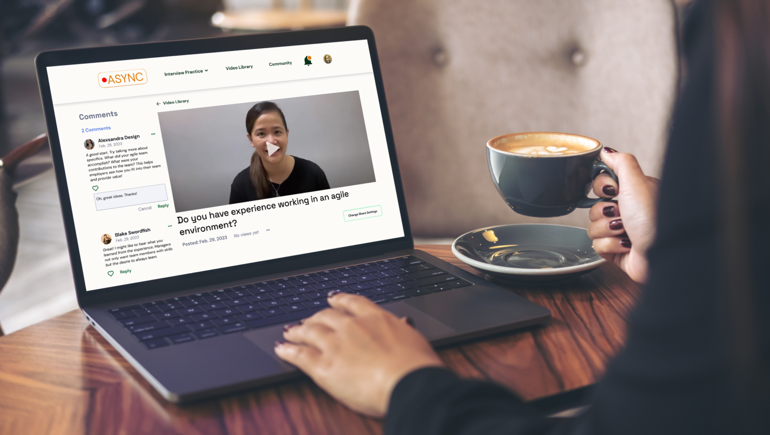 Woman drinking coffee looking at laptop with Async screenshot