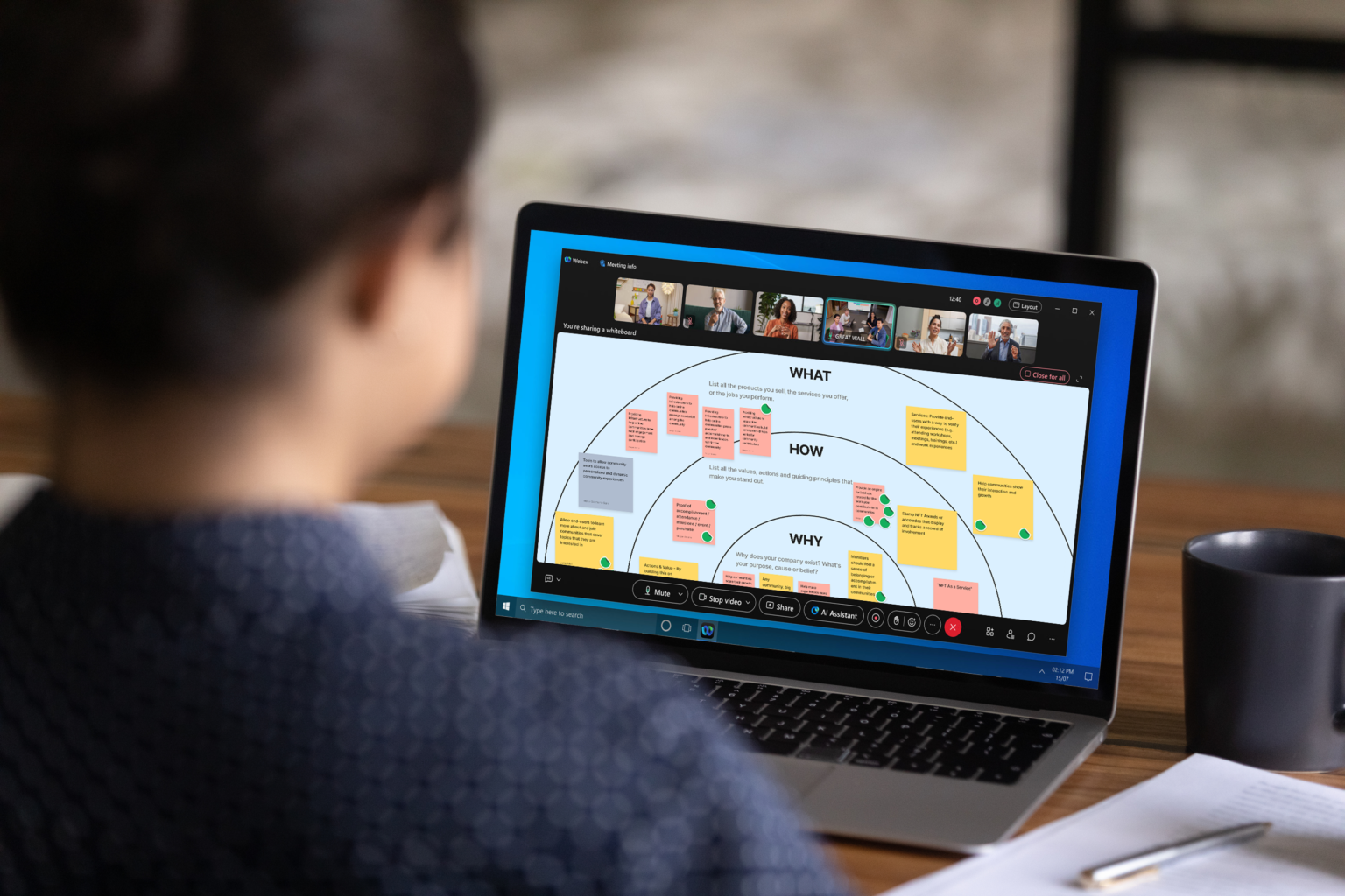 Woman participating in a virtual workshop on her laptop.